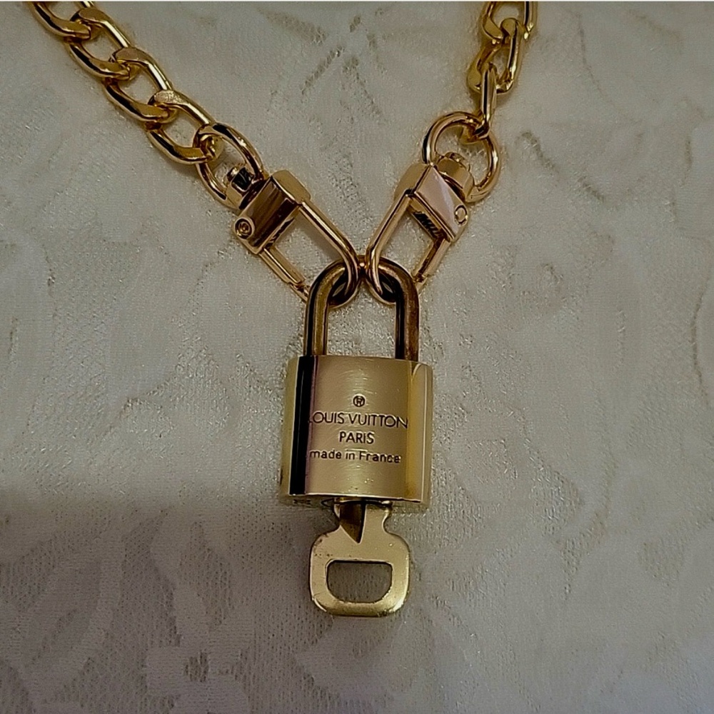 Louis Vuitton Elegant Gold Lock and Key